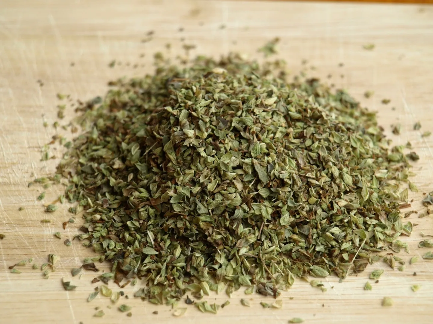 dried oregano on cutting board