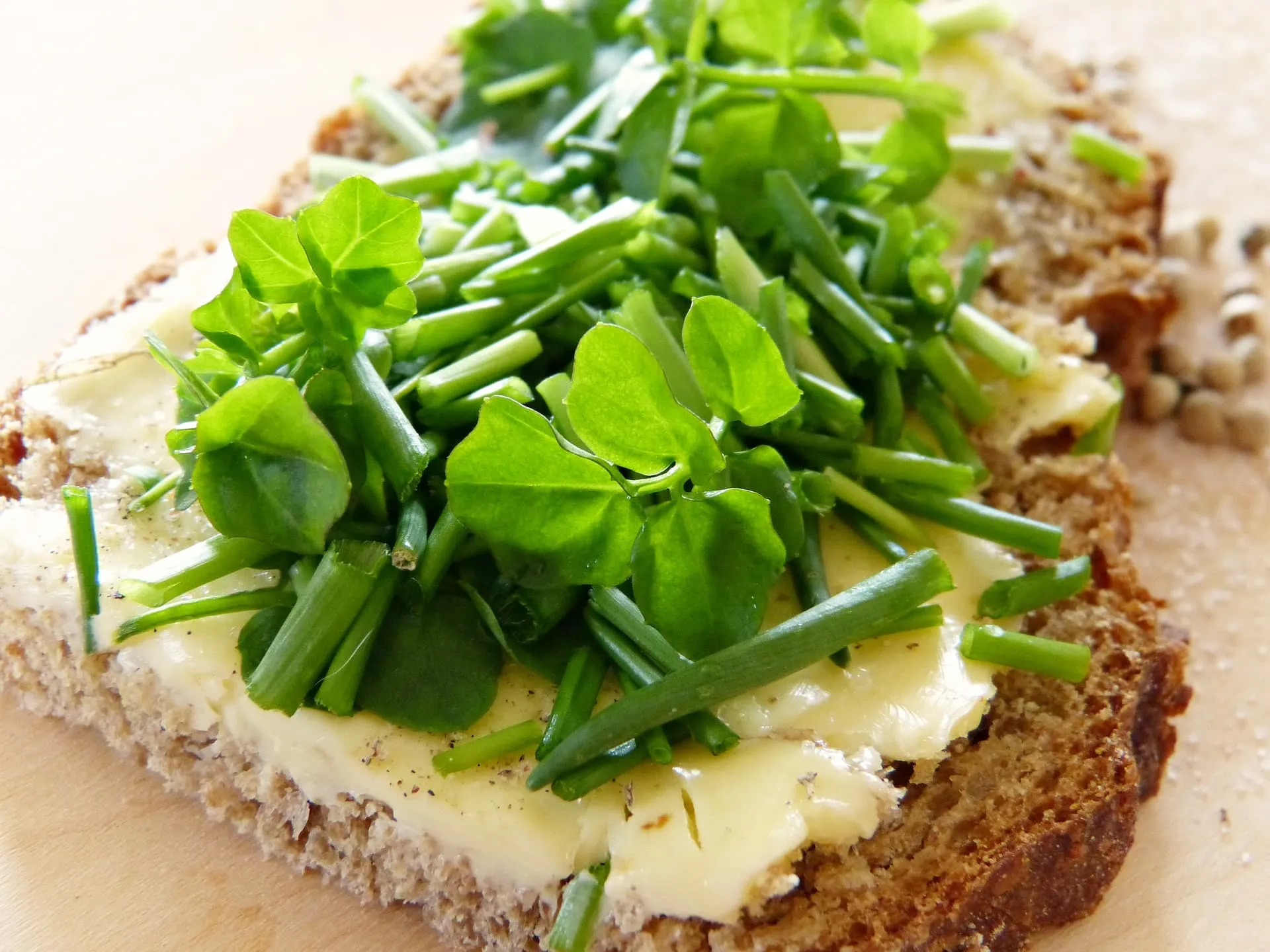 Close up of watercress and chive on toast