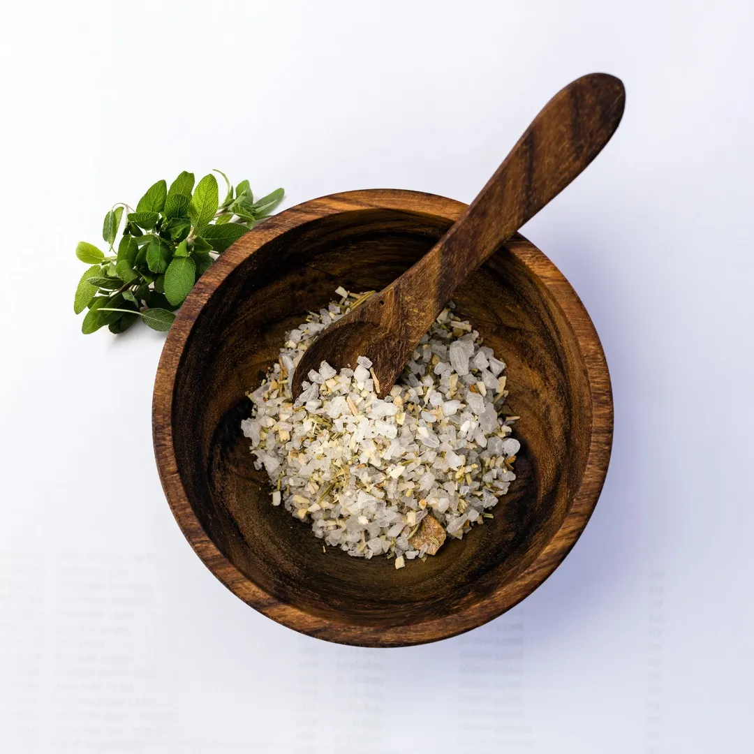 herb salt in wooden bowl